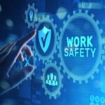 A hand is pointing to the word work safety on a blue background, emphasizing computer support.