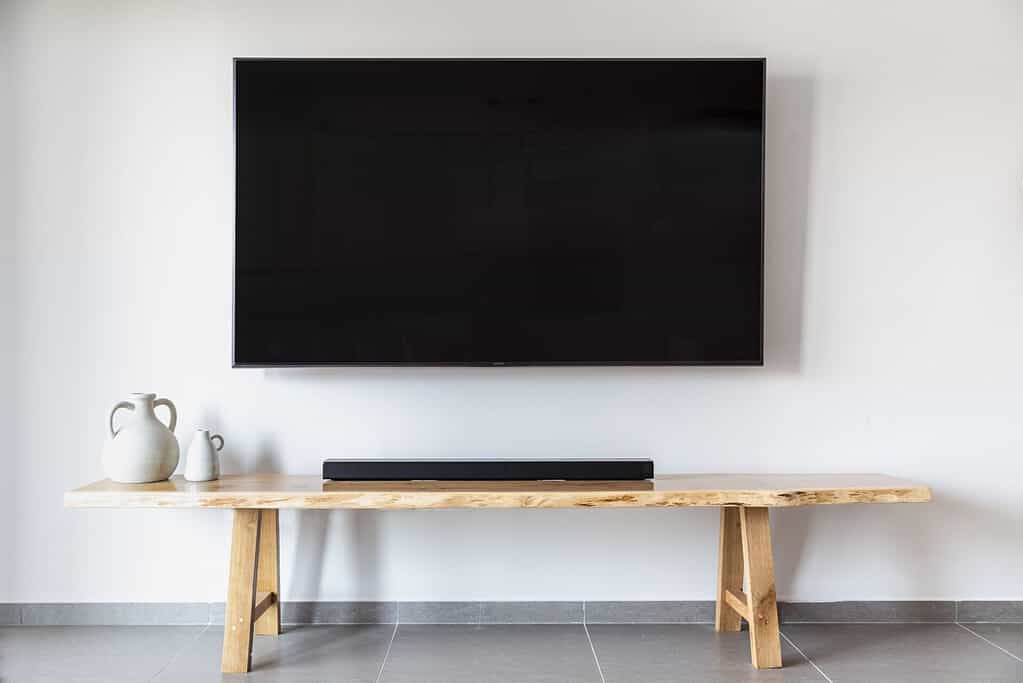 A wooden bench in a living room.