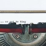 An antique typewriter displaying the thoughtful phrase "to blog or not to blog" captures the essence of writing in the digital age.
